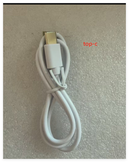 White USB cable with gold connector on a textured gray background