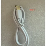 White USB cable with gold connector on a textured gray background