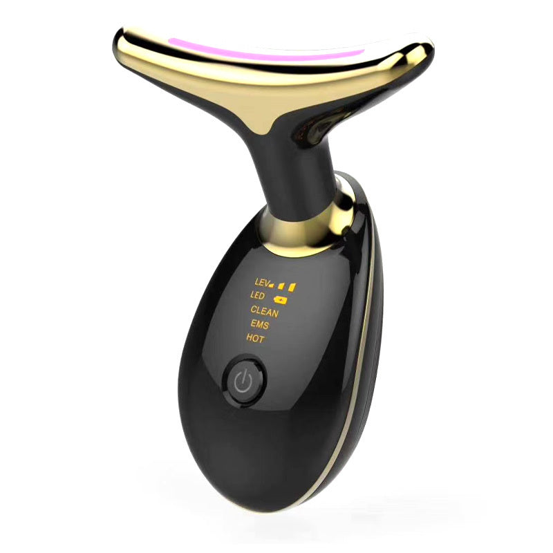 Black and gold electronic device on a white background