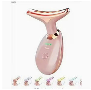 Rose gold facial cleansing brush with LED indicator on a white background