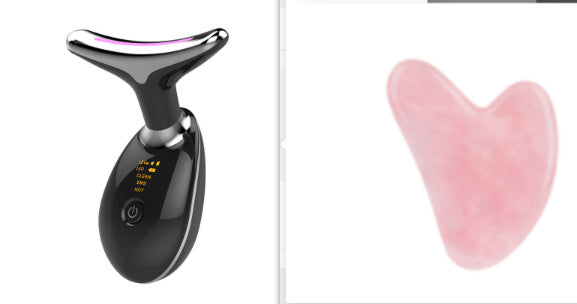 Black electronic device with digital display and pink heart-shaped object on a white background