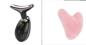 Black electronic device with digital display and pink heart-shaped object on a white background